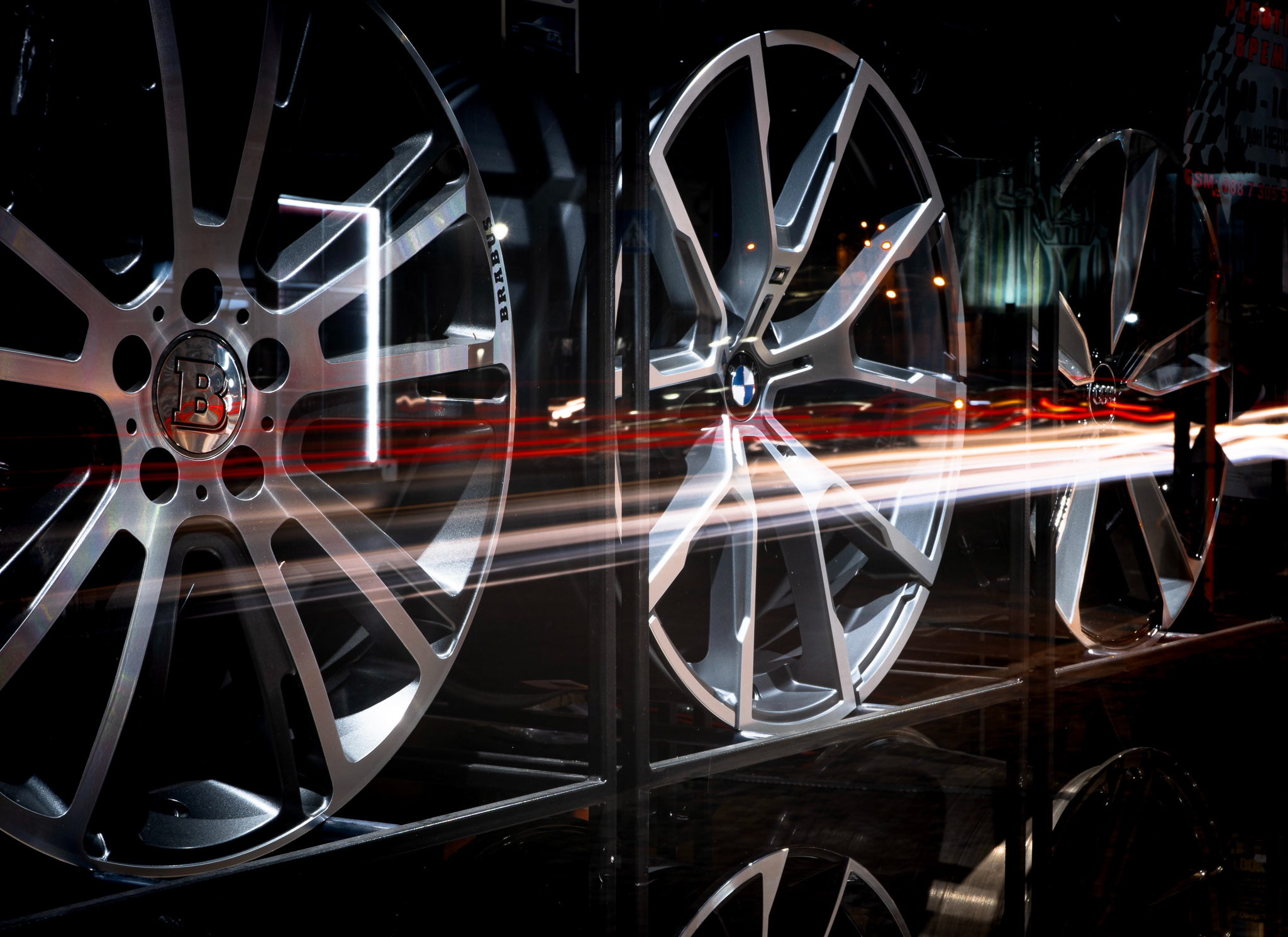 This image shows a rack of top quality designer wheels with a streak of light coming across the composition.